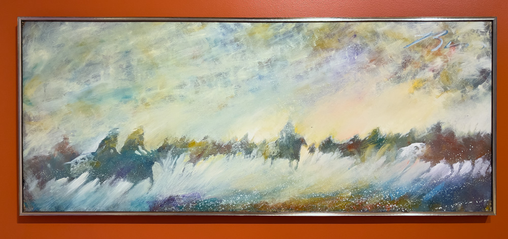 Earl Biss (Apsáalooke, 1947 - 1998) Charging Through a Rainbow Storm, 1997 Oil on canvas 36 x 89 inches (91.4 x 226.1 cm). Made alive in imagination by flowing, textured paint strokes is a landscape of Plains Indigenous horsemen, Charging Through a Rainbow Storm.