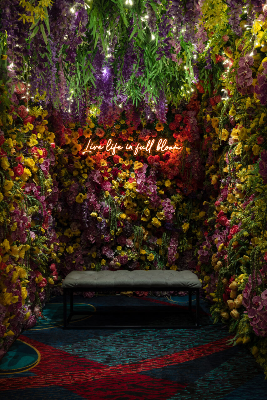 Installation View of Floral Entryway of In Bloom, 2023, Courtesy Bellagio Gallery of Fine Art. Photo: Jenks Imaging